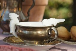 Vintage silver cup decorated with sugar figurines