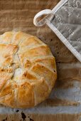 Puff pastry filled with camembert, bacon and potatoes