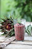 A chard smoothie in a glass