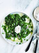 Grilled broccolini with peas, goat's curd and mint
