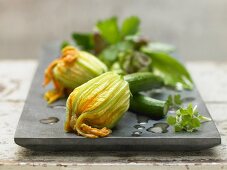 Stuffed courgettes with a herb salad