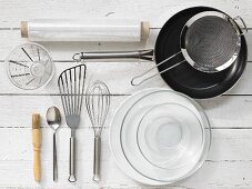 Kitchen utensils: pan, sieve, spatula, whisk, pastry brush, measuring cup