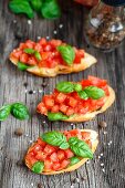 Tomato bruschetta with chopped tomatoes and basil on toasted bread