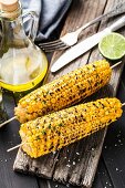 Delicious grilled corn on a wooden board