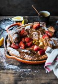 Dutch baby (omelette, USA) with strawberries