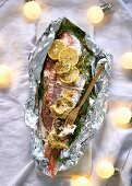 Fish with fennel and caper butter served in aluminium foil