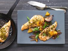 Salmon fillet with red onions and oranges