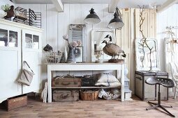 Collection of various vintage pieces in white interior