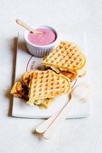 Heart shaped waffles with cherry sauce