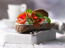 A wholegrain salmon sandwich with cucumber quark and spinach