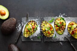 Grilled avocado halves with pineapple and monkfish ceviche