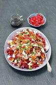 Radiccio and beetroot salad with roastbeef, pomegranate and caramelized walnuts