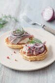 Pancakes with herring, onions and dill