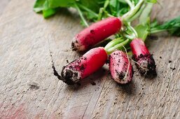 Fresh radishes on a wooden board