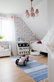 Vintage-style girl's bedroom in attic