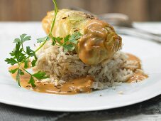 Cabbage rolls with veal, capers, garlic and caraway on rice