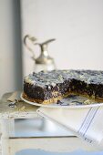 Poppy seed tart with almonds, sliced
