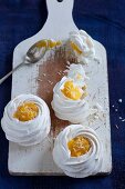 Meringue nests with mango and coconut