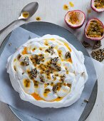 Pavlova with passion fruit sauce and sesame seed brittle