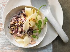 Pappardelle with radish and ham sauce and pine nuts