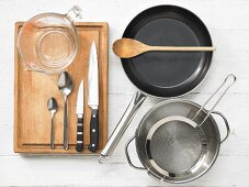 Kitchen utensils for the preparation of pasta with vegetables and ham
