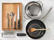 Kitchen utensils for the preparation of noodles with asparagus and orange