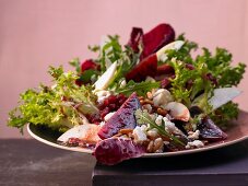 A salad with Nashi pear, pomegranate seeds, feta and beetroot