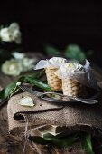 Baskets of ricotta cheese on table