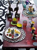 Table set with ethnic ornaments and round place mats