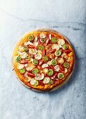 Leek and garlic pizza with cherry tomatoes and mozzarella