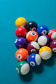 Racked pool balls on blue baize