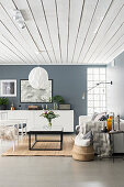 Grey and white living room with white wood-clad ceiling