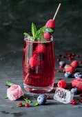 Raspberry lemonade with mint and ice cubes