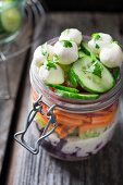 Couscous salad with red cabbage, yoghurt, lettuce hearts, carrot, tomato, cucumber, mozzarella and parsley