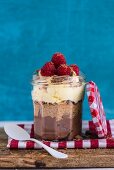 Meal in a Jar: Dark Chocolate Cheesecake topped with Crushed Biscuits and Cacao Nibs and White Choc Cream