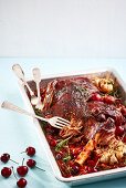 Oven-cooked lamb shank with cherries