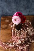 Bouquet of ranunculus on lace cloth