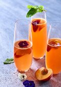 Nectarine sangria with flowers and mint