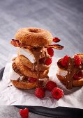 Doughnuts filled with marshmallows, bacon, chocolate and raspberries