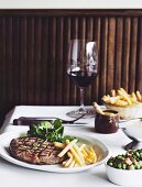 Steak Frites with sauce bearnaise and peas