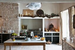 Stone wall and festive nativity scene in kitchen