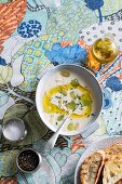 White almond gazpacho with avocado oil and grapes