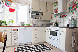 Old kitchen with floral wallpaper