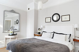 Two-tone walls in elegant, monochrome bedroom
