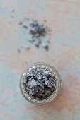 Black salt in a glass (seen from above)