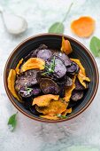 Homemade sweet potato and blue potato crisps