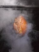 Ham in a smoking chamber