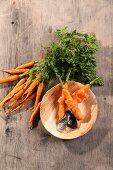 Oven-baked carrots wrapped in rainbow trout