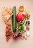 Ingredients for tomato and bread salad with roasted pumpkin seeds