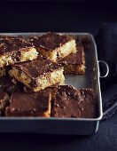 Semolina and coconut tray cake with coconut and liquorice confectionery